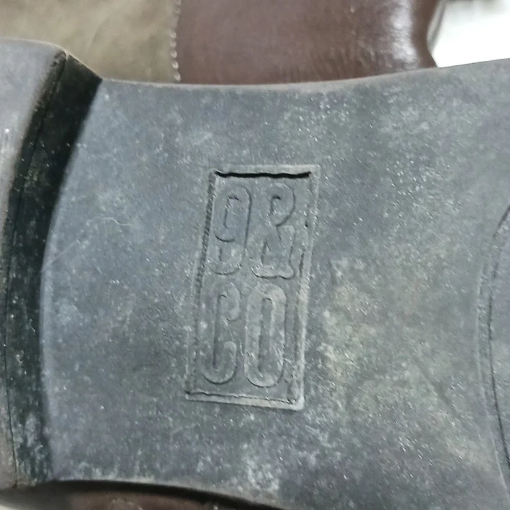 9&Co size 8 brown tall boots, with decoractive buckles. Man made materials.